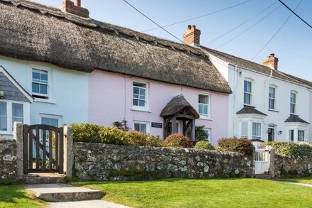 Just a stone's throw away from the water's edge, thatched Trevarrow Cottage is the ideal place to un