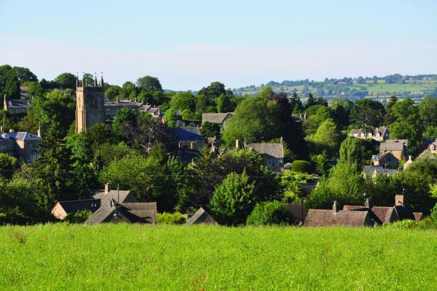 6 Mount Pleasant sits within a pretty terraced row of Cotswold cottages