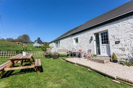 Family friendly country barn cottage on rural farm surrounded by rolling hills