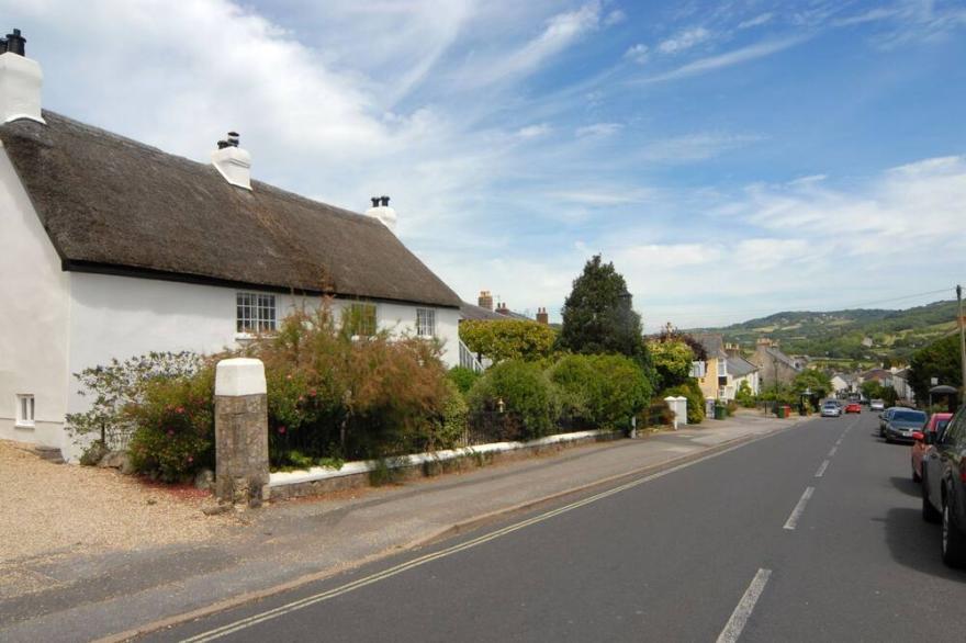 A Thatched, 17th Century Home In A Central Position Within Charmouth.