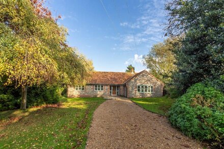 A beautiful flint fronted detached bungalow, set in glorious gardens