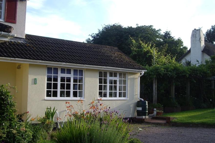 Set In Quiet, Rural Surroundings In The Heart Of The Otter Valley.