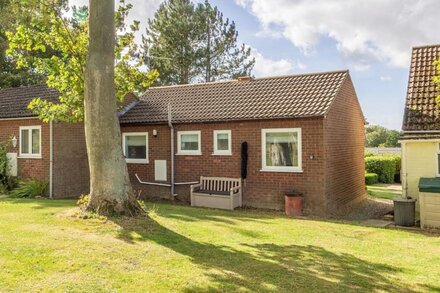 A modern little holiday bungalow set in a peaceful wooded location.