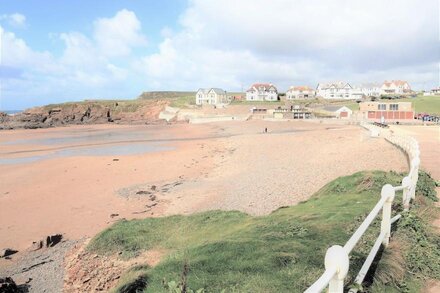 Pendragon House Overlooks Crooklets Beach in Bude with parking for 5 cars.