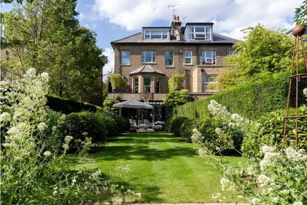 Luxury architect-designed 4 bed house with landscaped gardens moments from tube.