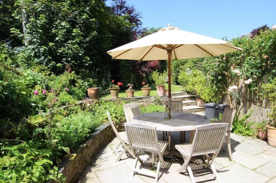 Hollyhocks Cottage is a semi detached country cottage in the hamlet of Helland Bridge on the Camel trail