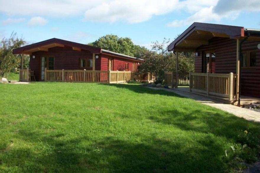 Large three bedroom lodge with private hot tub, located in the 