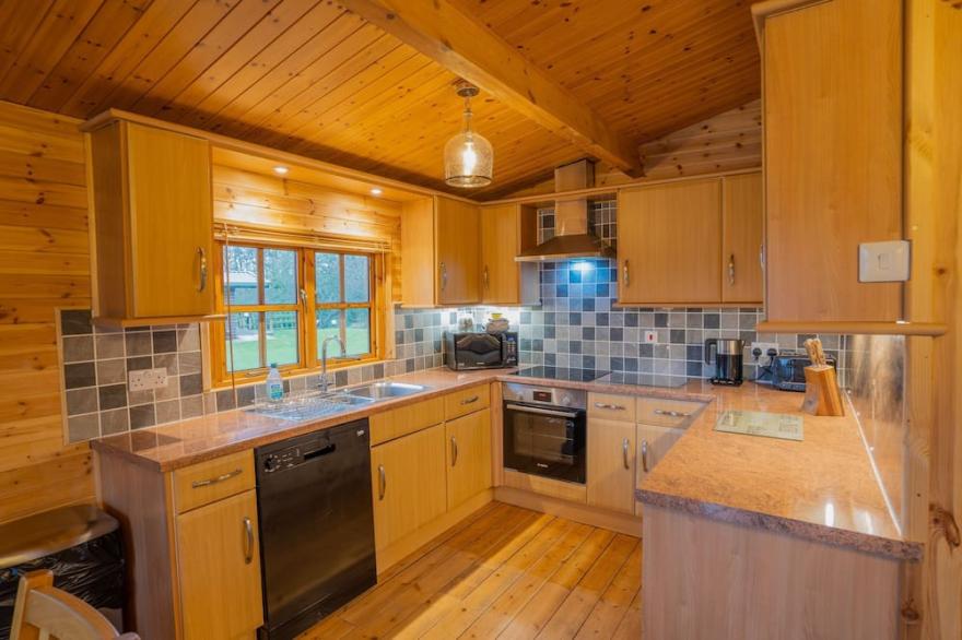 Large three bedroom lodge with private hot tub for five people