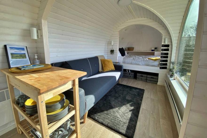 Luxury glamping with stunning sea views in unique, wooden-clad cabins!