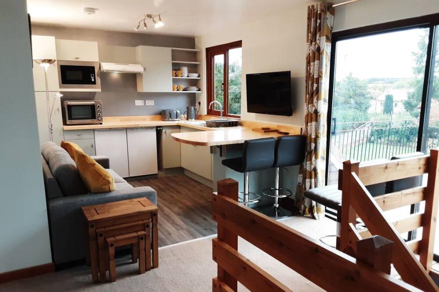Bright, airy first floor apartment with balcony in rural location