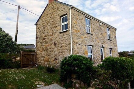 Traditional granite cottage above Sennen Beach