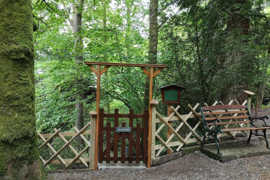 Luxury pine log cabin positioned within the mountains of the Lake District