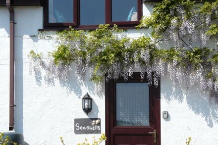 Beach and coastal path location with sea views at Lligwy Beach Moelfre Anglesey