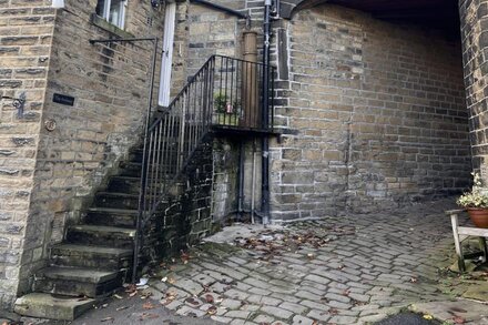 Cosy cottage on the cobbles of Haworth main street.