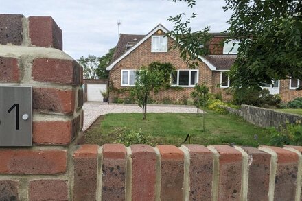 Family home with spacious garden and views in central Sussex