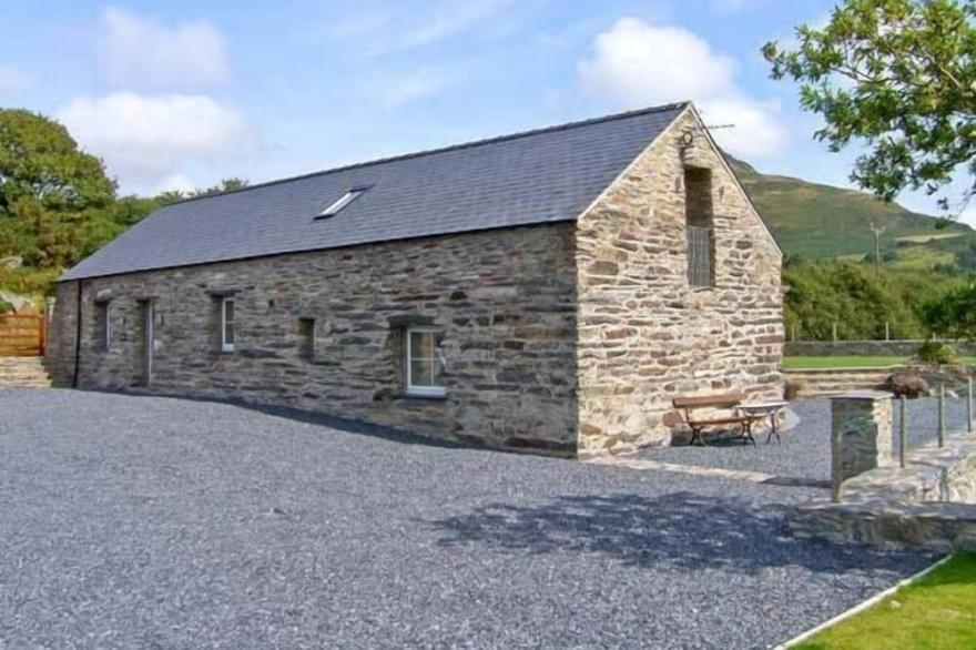 GARTH MORTHIN THE BARN, pet friendly, with open fire in Porthmadog