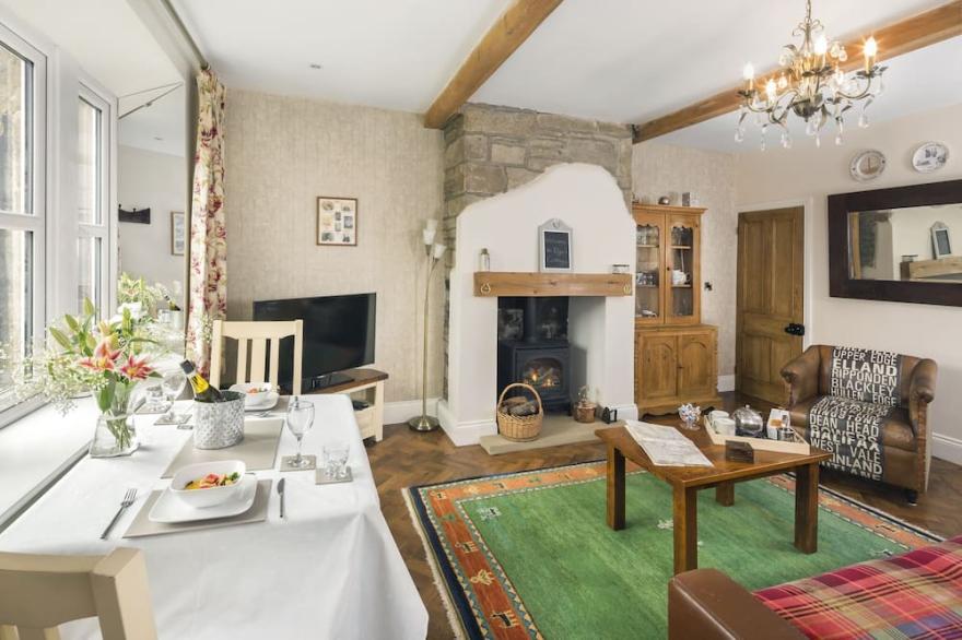 A beautifully presented 1650 cottage in Halifax with wonderful moorland views