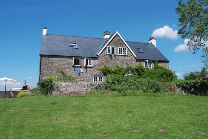 Stunning Welsh Farmhouse, Panoramic Views, Pizza Oven + Hot Tub