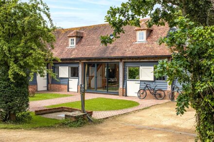 Luxury Cottage in Sussex with hot tub and outdoor fireplace.