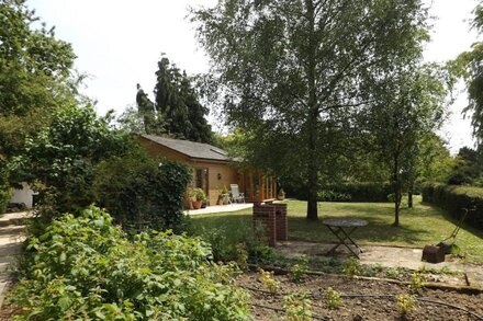 A beautiful pine chalet with its own private garden surrounded by fields