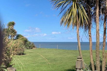 Log Cabin next to our sandy beach with lovely sea views, close Norfolk Broads.