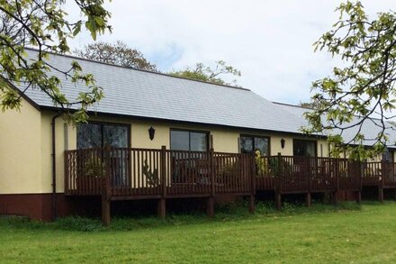 Spacious two-bedroomed fully-accessible lodge with lake view in rural idyll