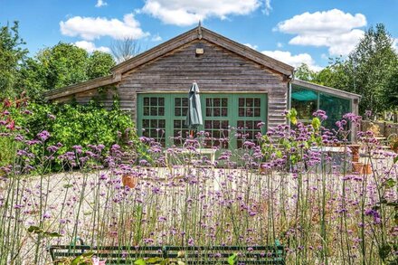 The Garden Room. Timber framed, light and airy accommodation with veranda.