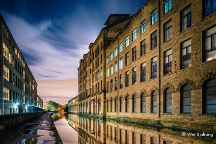 Swans glide past your window on the canal in this luxury Apartment