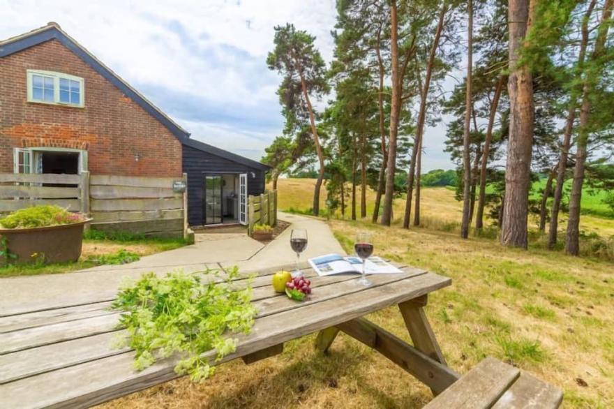 This stylishly converted dairy is set in an idyllic location.