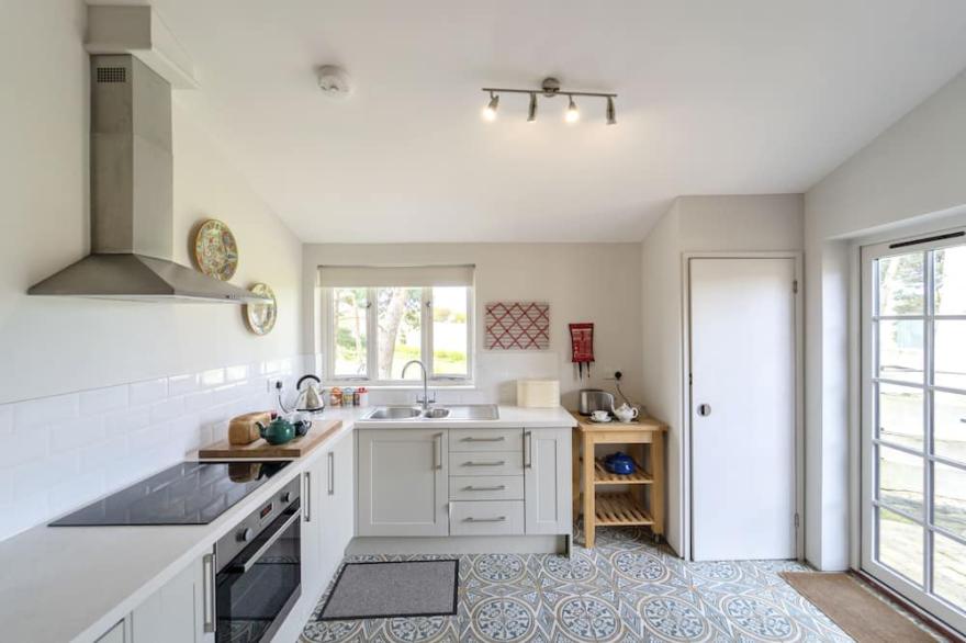 This stylishly converted dairy is set in an idyllic location.