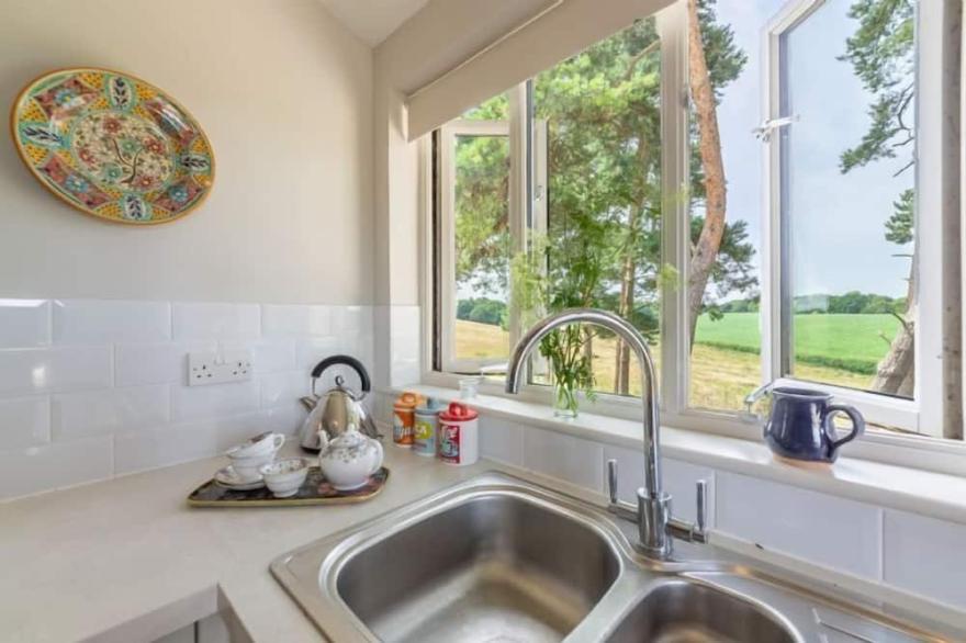 This stylishly converted dairy is set in an idyllic location.