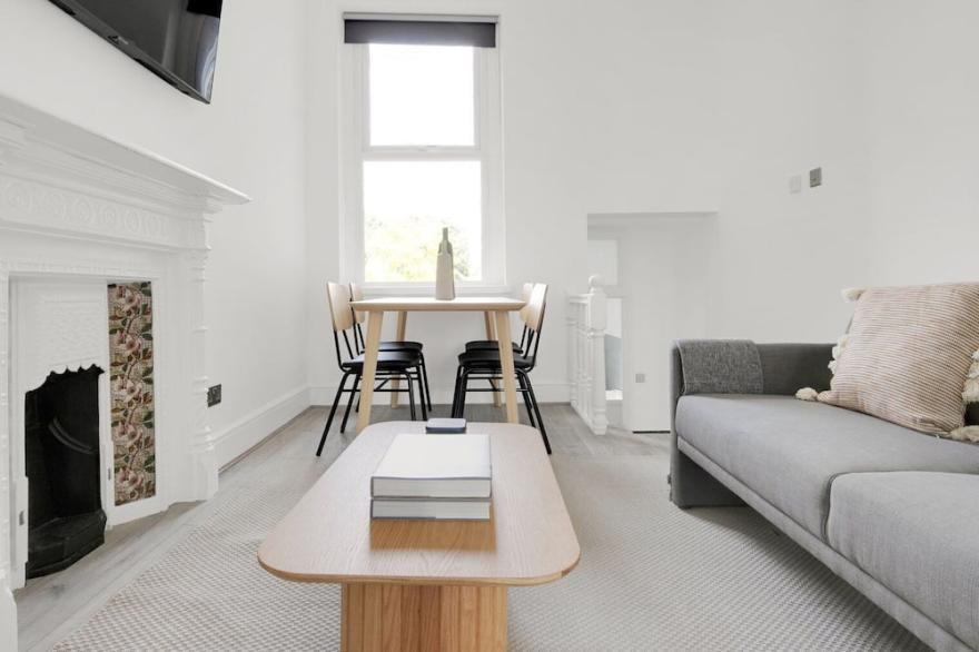 Sunny Earls Court 2BR, newly refurbished, opposite Tube, by Blueground