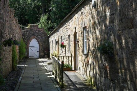 CRASTER TOWER COACH HOUSE, pet friendly, with open fire in Craster