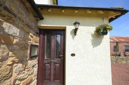 DAIRYMAN'S COTTAGE, with a garden in Amble