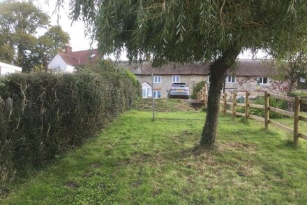 Beautiful thatched country cottage, quiet countryside position .