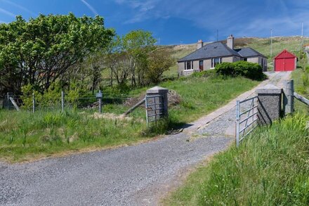 Detached spacious Isle of Lewis cottage in tranquil position with loch view