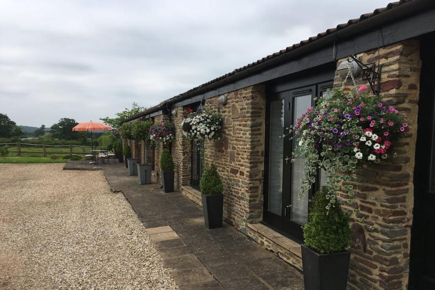 Elegantly furnished former barn in quiet rural spot, South Cotswolds.