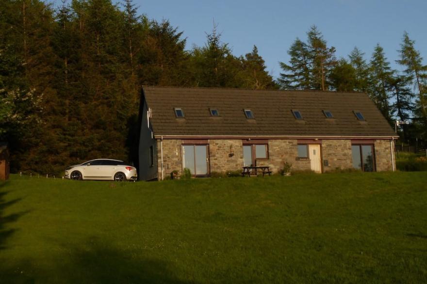 Well equipped home with loch, mountain and woodland views