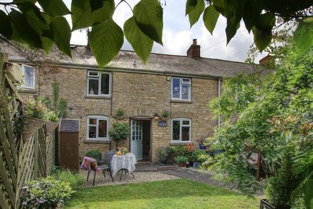 Bay Tree Cottage  is tucked away in an elevated position on the edge of a pretty village.