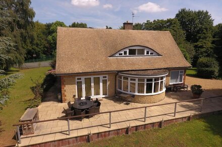 Luxury Lakeside Home In extensive grounds with boats, canoes and tennis court.