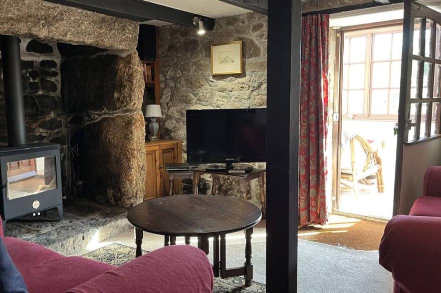 Poldhu Cottage is a Cornish granite cottage full of charm located in St Buryan near the Minack Theatre