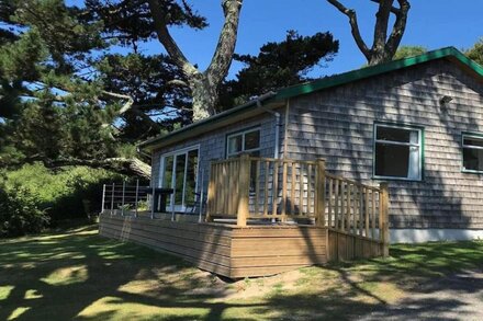 Windwhistle, an older style detached bungalow with superb views along the coast