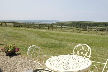 Skylark, a double glazed converted barn with far reaching views over St Ives and with beaches nearby