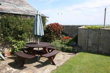 Waddles, a renovated stone cottage set around a courtyard featuring its own enclosed garden