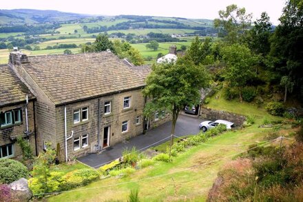 Traditional stone cottage in Barkisland. Superb views. Pet friendly. Four Stars.