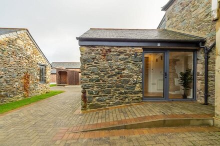 A single-storey barn conversion with access to wonderful coastal walks.