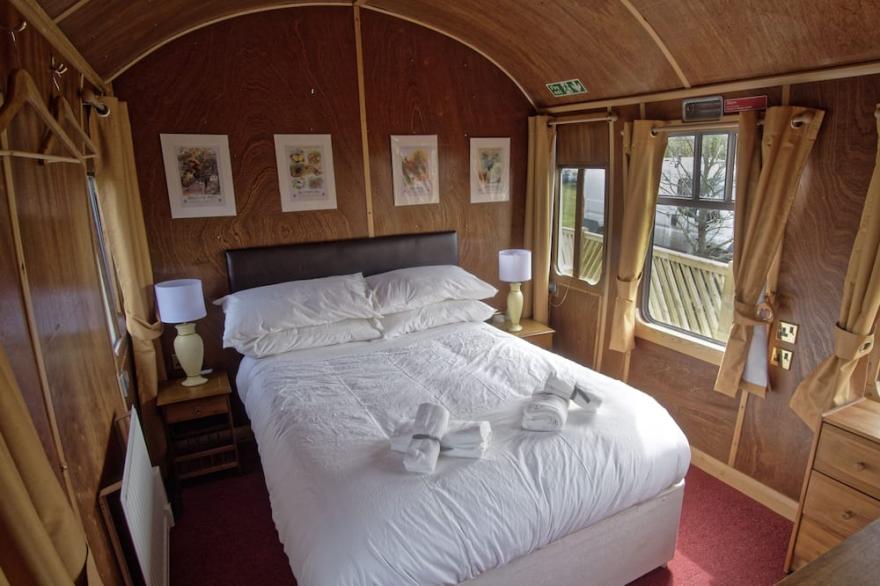 A Carefully Converted  Heritage Railway Coach In The Countryside.