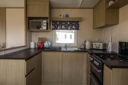 Caravan with decking at Coopers Beach Holiday Park ref 49012CW