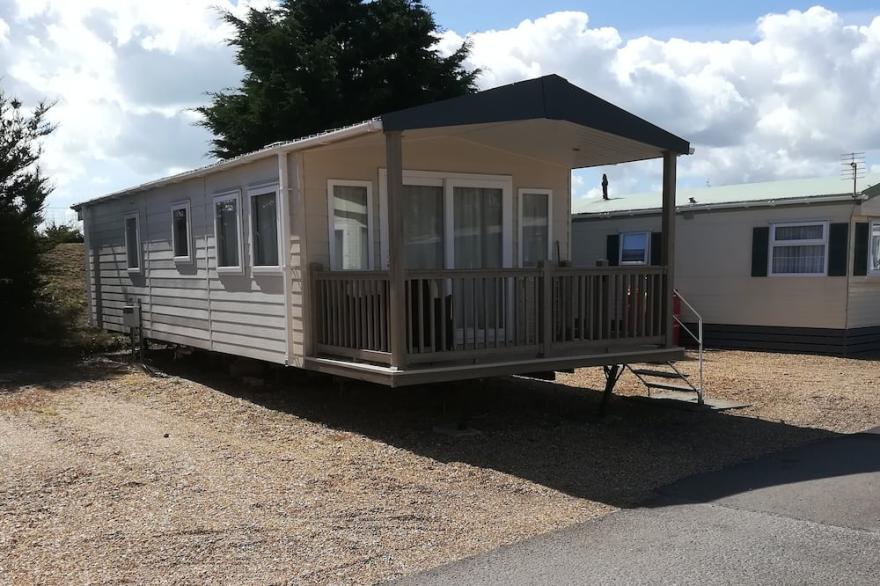 This Caravan Has A Covered And Fenced Veranda