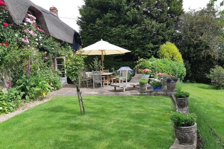 Picture book roses round the door three bedroom stone and thatch cottage